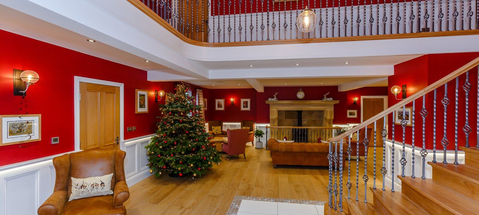 Christmas tree in hall showing staircase and landing