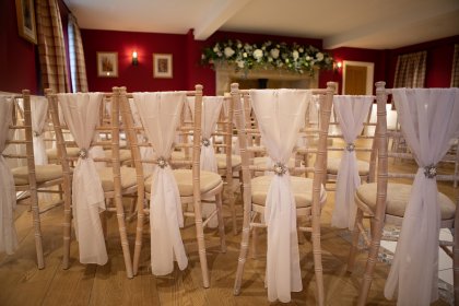 White chairs arranged for ceremony