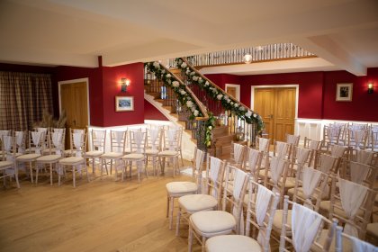 Hall arranged with chairs for ceremony