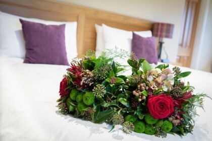 Bouquets of flowers on a bed
