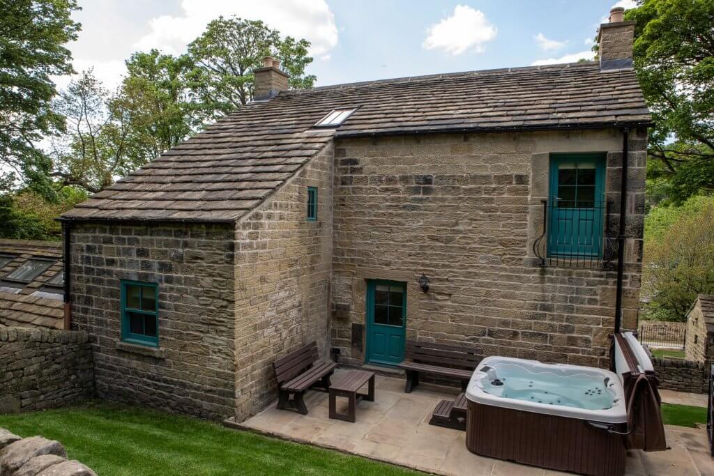 Rear of cottage with hot tub