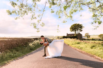 Bride and groom posing for photograph
