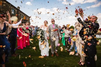 Confetti shower on bridal party