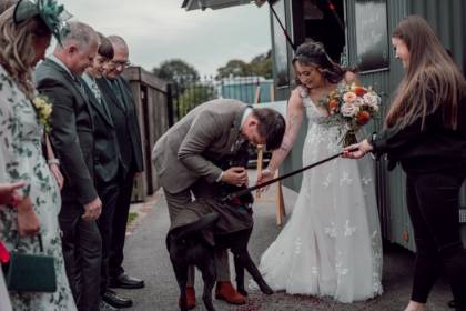 Bridal couple with their dog